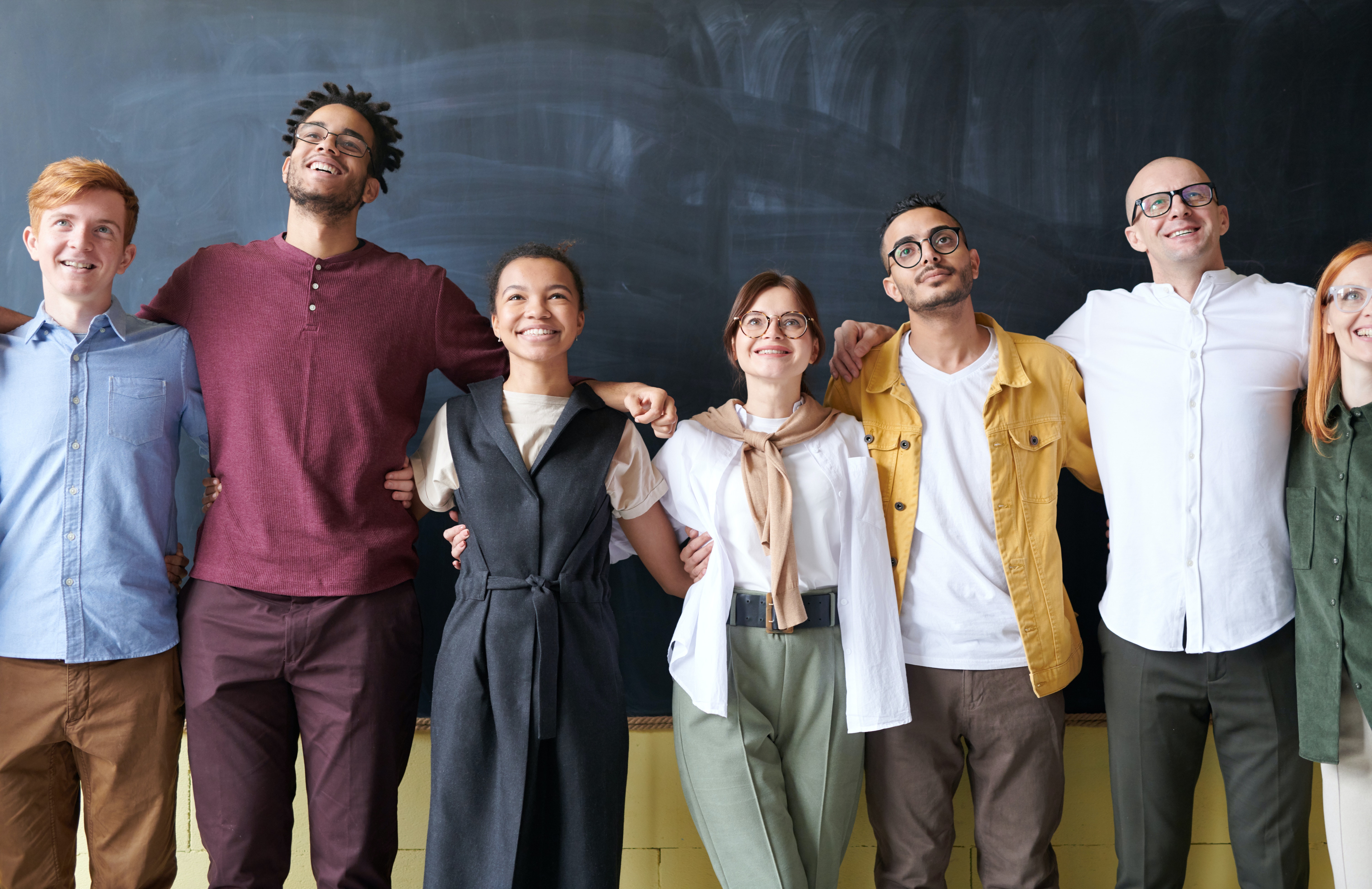 Group of smartly dressed smiling people